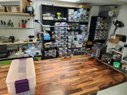 Elevated shelf attached to one end. Note the table-clamped AC outlet has a wood frame around it. Elevated shelf attached to one end. Note the table-clamped AC outlet has a wood frame around it.
