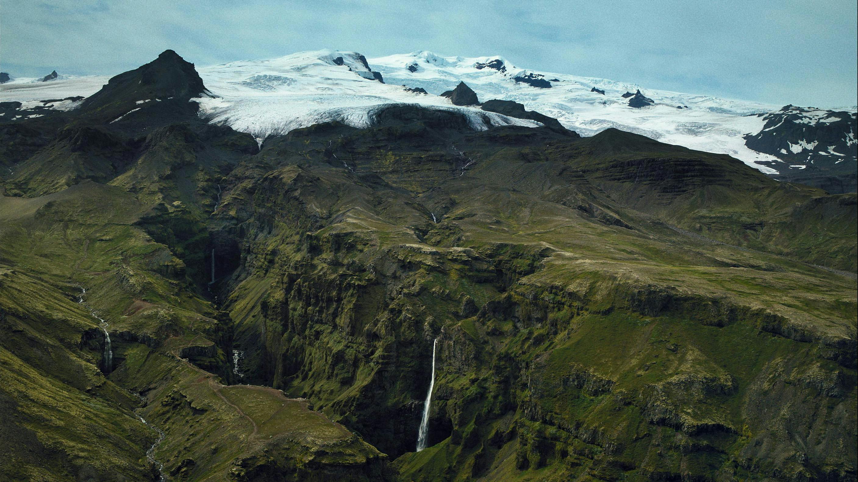 A glacial tongue behind a waterfall.