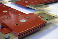 Multi-conductor busbar that’s been powder-coated using the fluidized bed method Multi-conductor busbar that’s been powder-coated using the fluidized bed method
