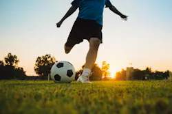 Soccer player prepares to kick the ball, illustrating the movement that motion sensors can capture during play